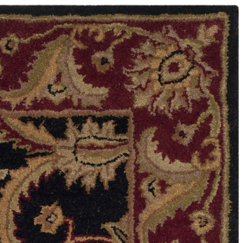 Charlton Home® Bromley Handmade Wool Black / Burgundy Rug & Reviews